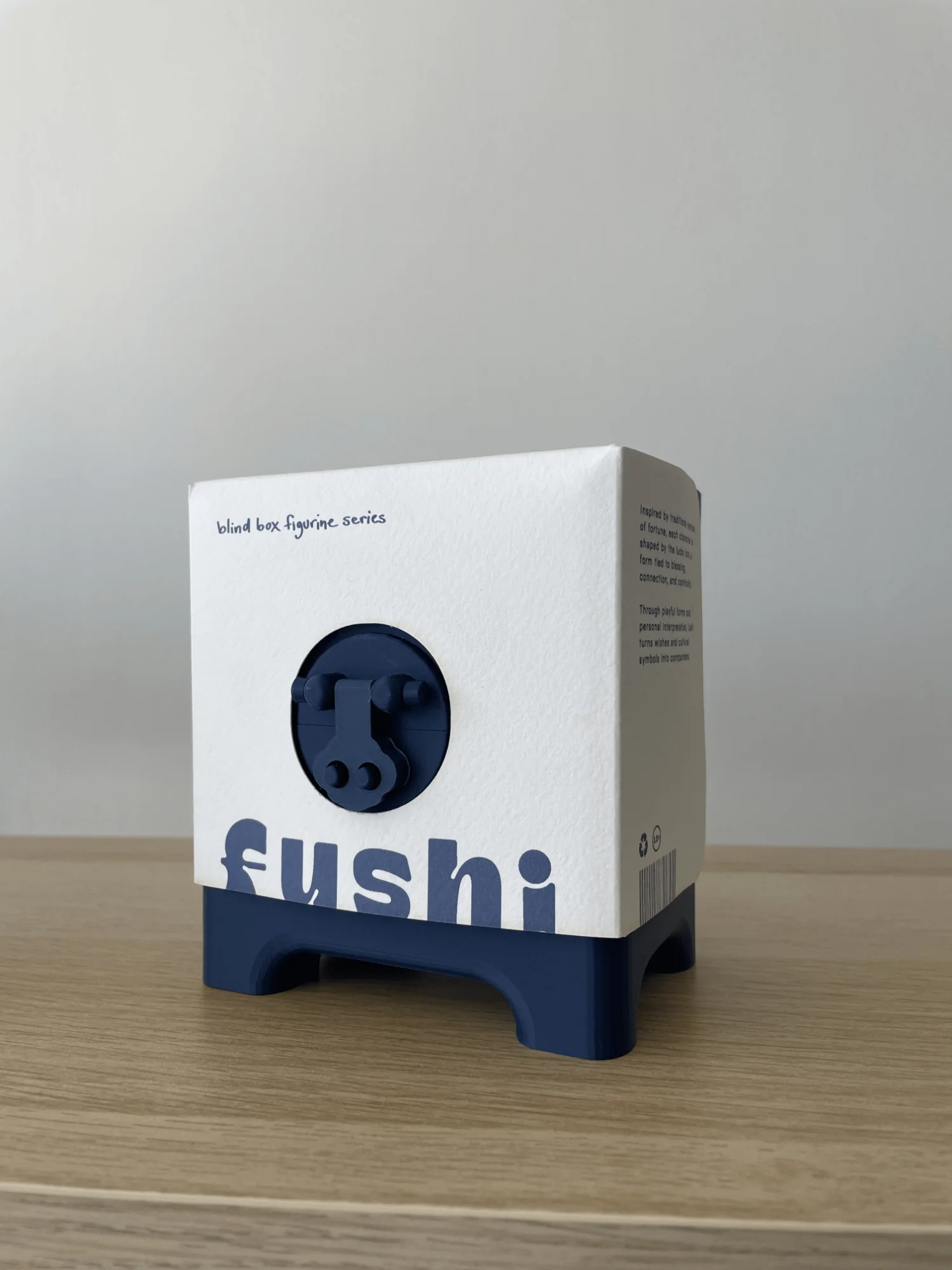 The final FUSHI box: navy FDM printed base and latch inside a white watercolour paper sleeve